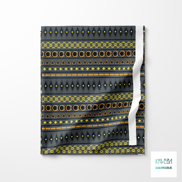 Geometric shapes in dark teal, yellow, orange and black fabric