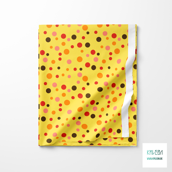 Random brown, orange and red polka dots fabric