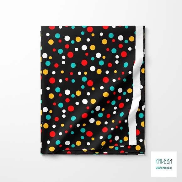 Random teal, yellow and red polka dots fabric