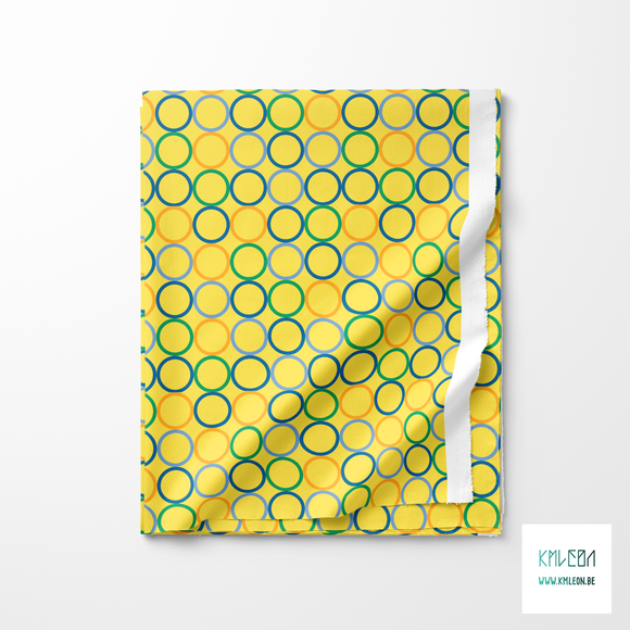 Random orange, blue and green circles fabric