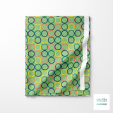 Random coral, green, yellow and navy circles fabric