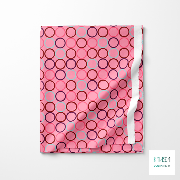 Random pink, red, purple and light blue circles fabric