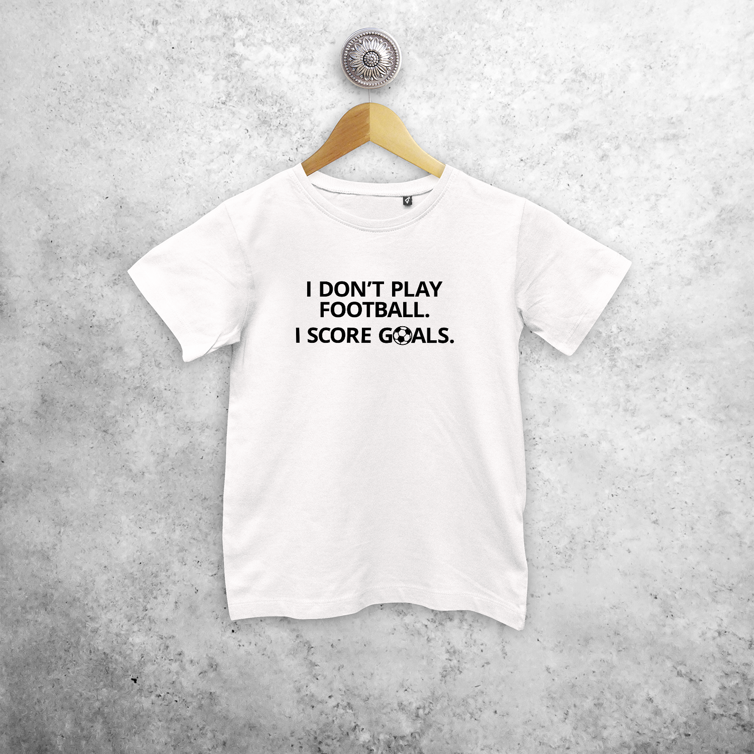 'I don't play football. I score goals.' kids shortsleeve shirt