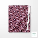 Purple and pink leopard print fabric