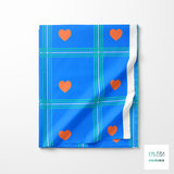 Blue and teal plaid with orange hearts fabric