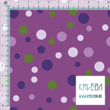 Random purple and green polka dots fabric