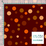 Random brown, beige and orange polka dots fabric