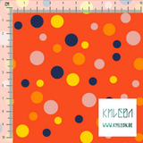 Random pink, yellow, orange and navy polka dots fabric