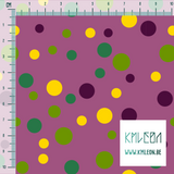 Random purple, green and yellow polka dots fabric