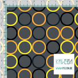 Random orange, yellow, dark teal and black circles fabric