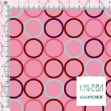 Random pink, red, purple and light blue circles fabric