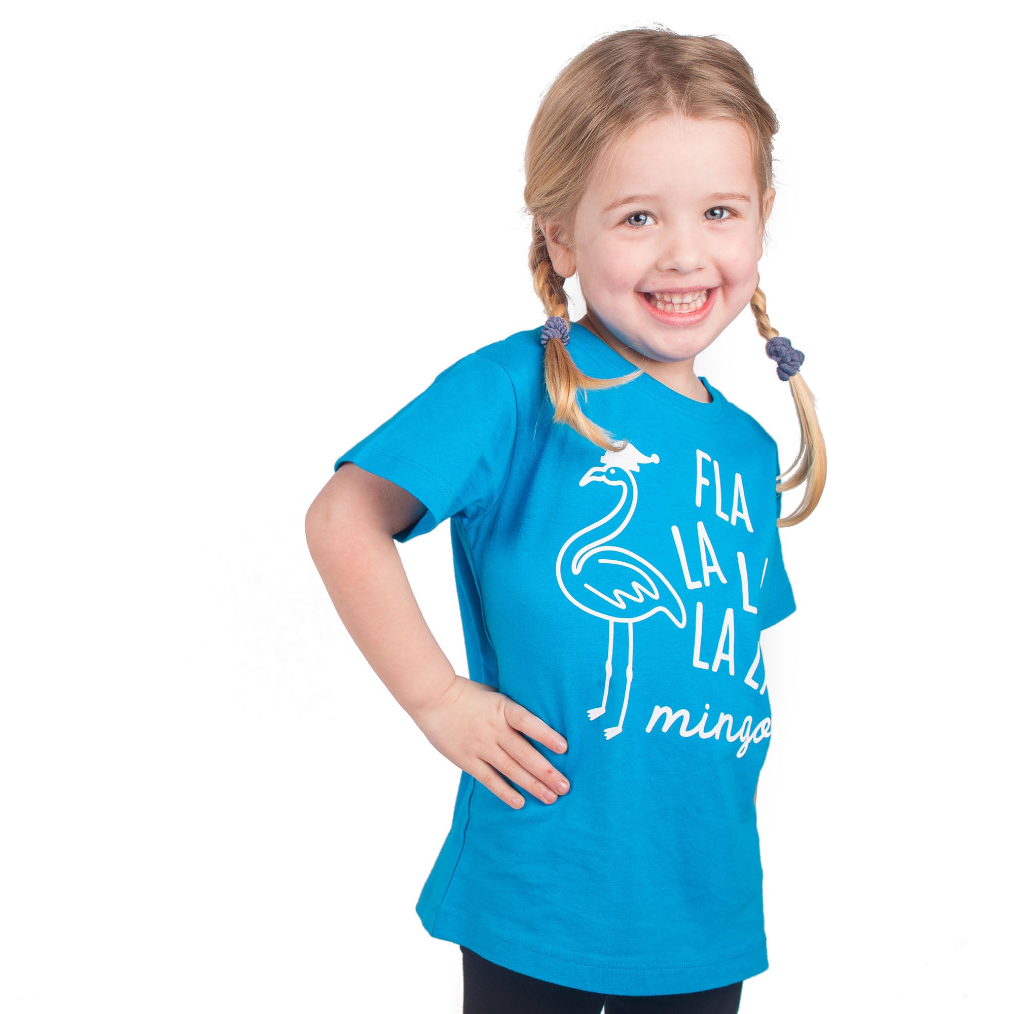 Smiling blonde girl with pigtails wearing aqua shirt with 'Fla la la la la mingo' print by KMLeon.