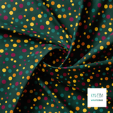 Random purple, yellow, orange and green polka dots fabric