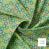 Random coral, green, yellow and navy circles fabric