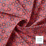 Random teal, pink, blue and black circles fabric