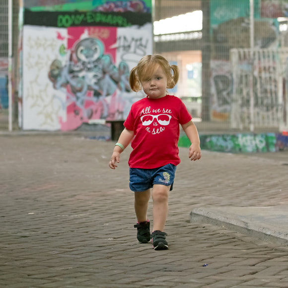 'All we see is the sea' baby shortsleeve shirt