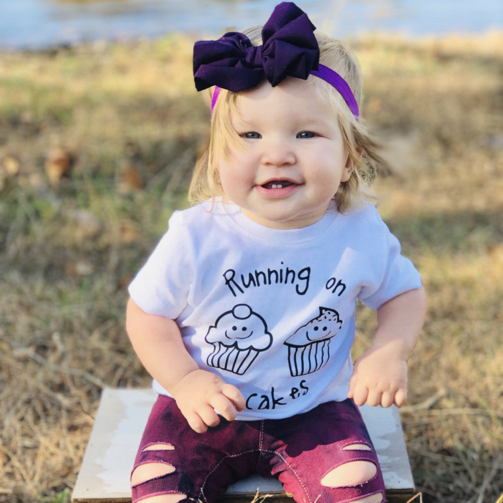 'Running on cupcakes' baby shortsleeve shirt