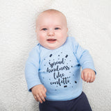 'Spread kindness like confetti' baby longsleeve shirt