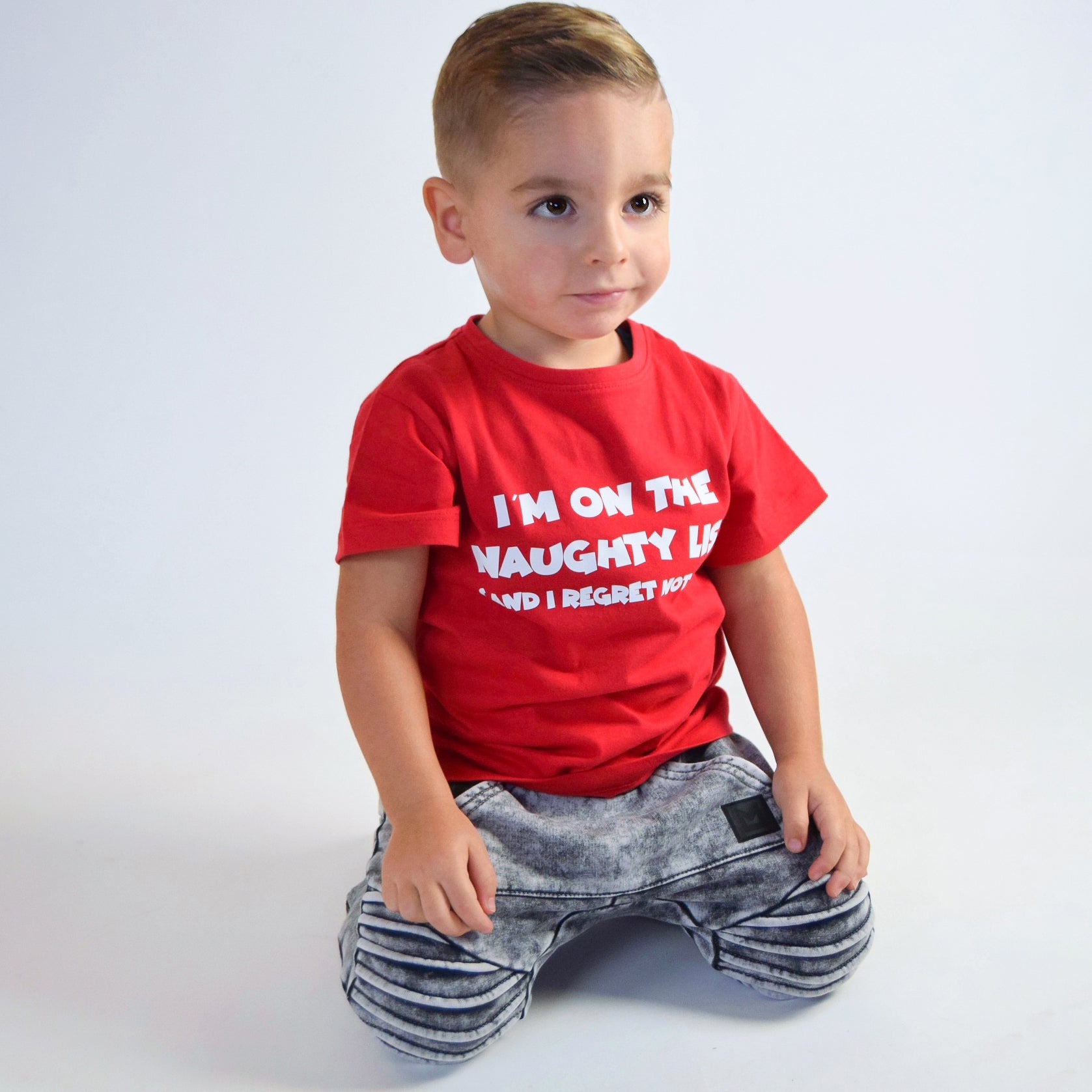 'I'm on the naughty list' kids shortsleeve shirt