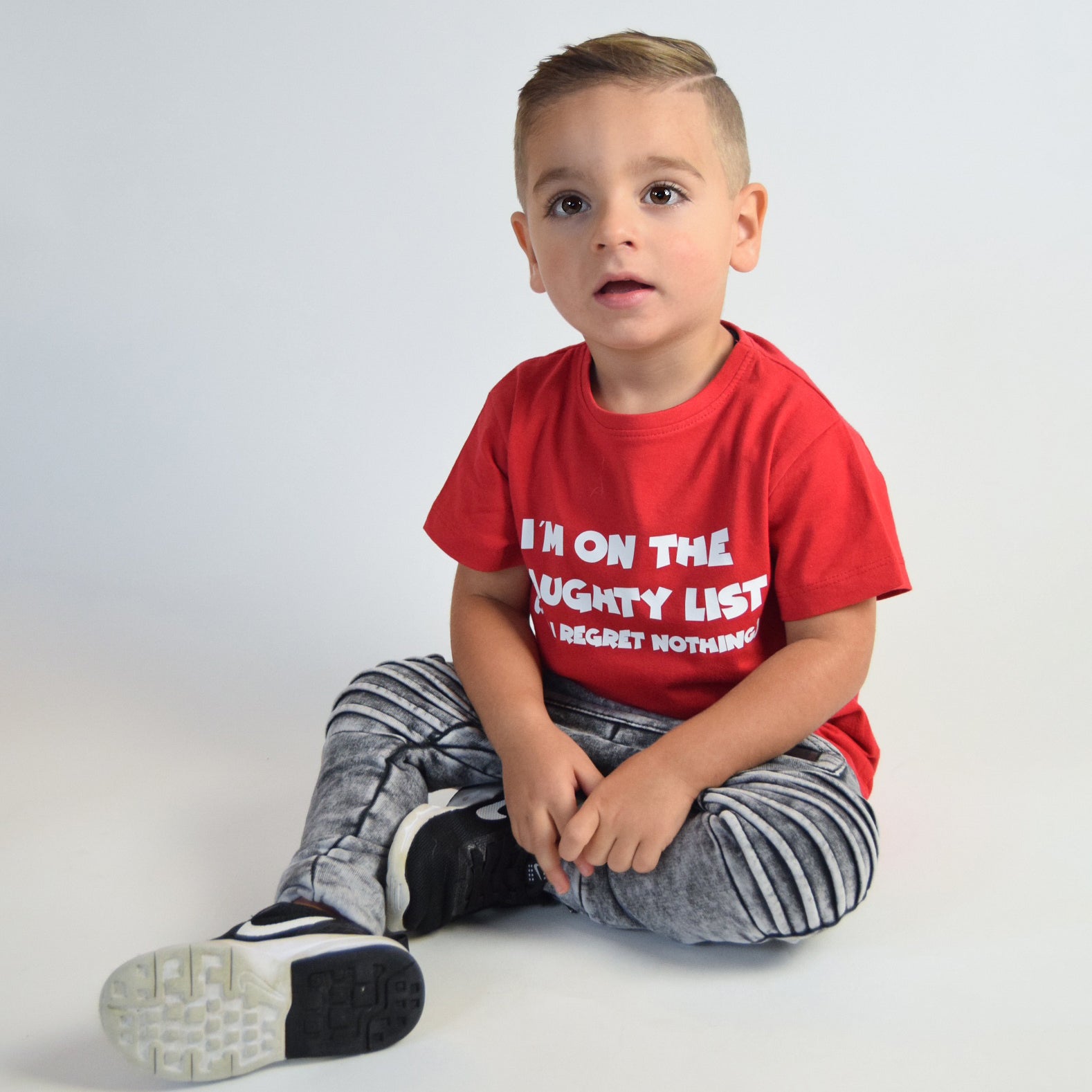 'I'm on the naughty list' kids shortsleeve shirt