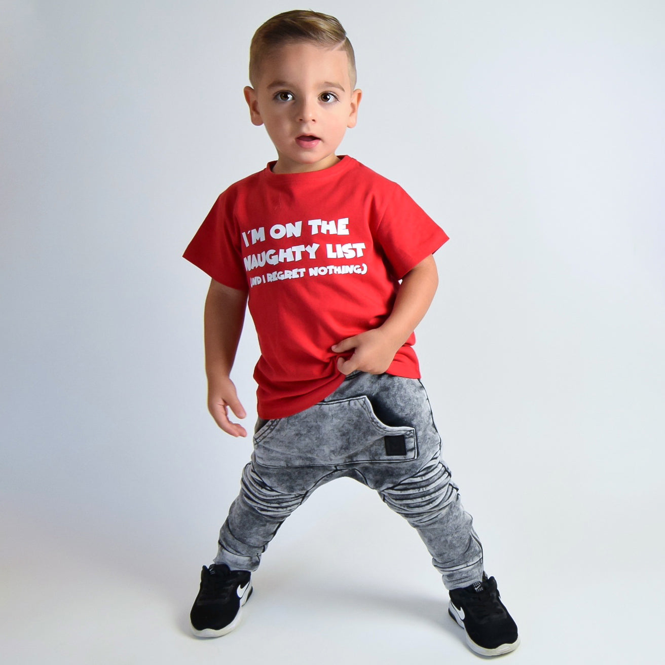 'I'm on the naughty list' kids shortsleeve shirt