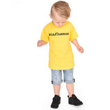 Blonde boy looking down with yellow shirt, with '#influencer' print, by KMLeon.