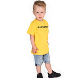 Blonde boy with yellow shirt, with '#influencer' print, by KMLeon.