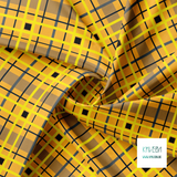 Yellow, grey, dark teal and black plaid fabric