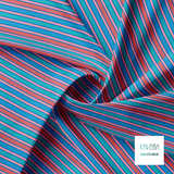 Blue, pink, teal and red vertical stripes fabric