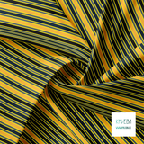 Grey, black, orange and dark teal vertical stripes fabric