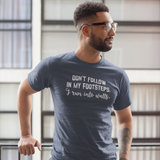 'Don't follow in my footsteps. I run into walls.' adult shirt