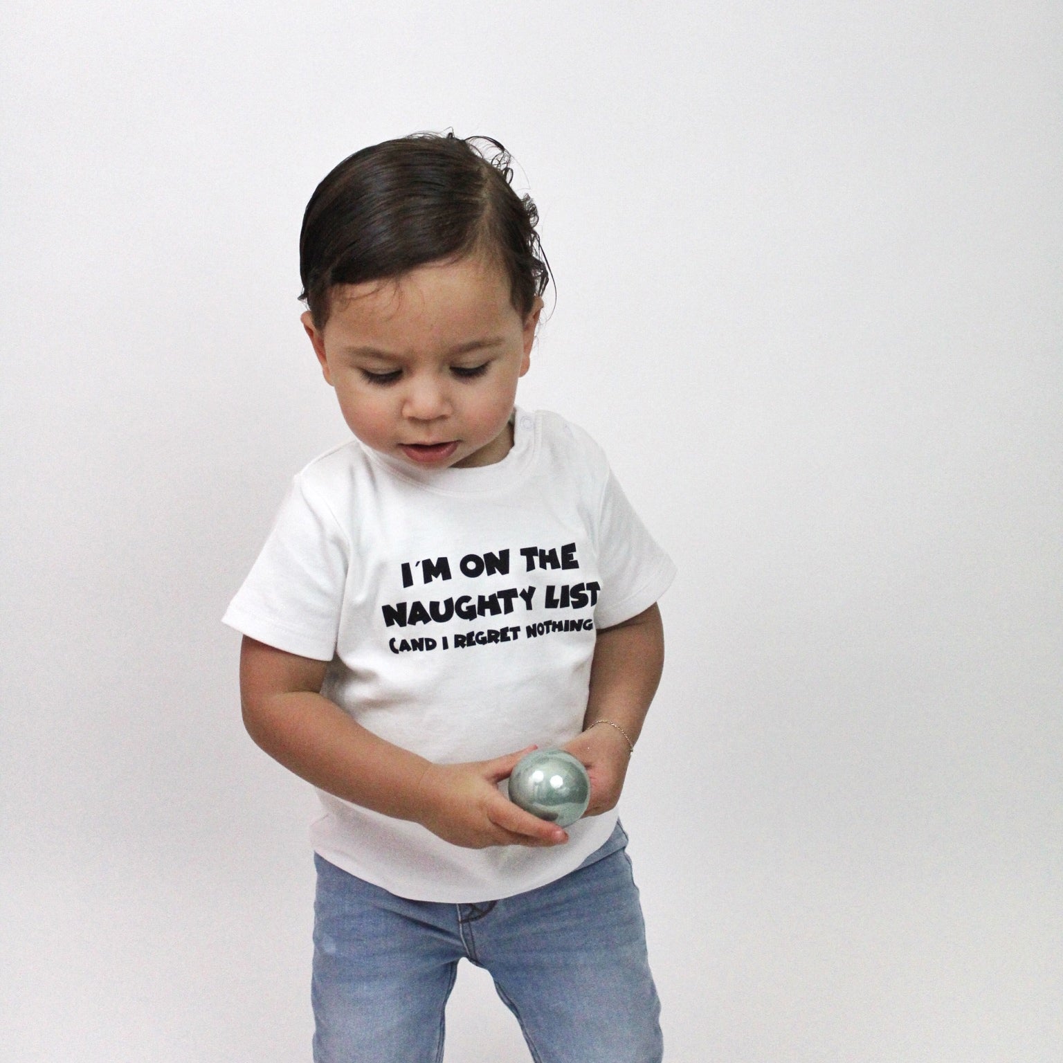 'I'm on the naughty list' baby shortsleeve shirt