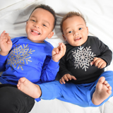 Happy young black brothers wearing shirts with long sleeves with glitter snow star print by KMLeon.