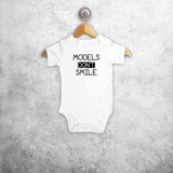 'Models don't smile' baby shortsleeve bodysuit