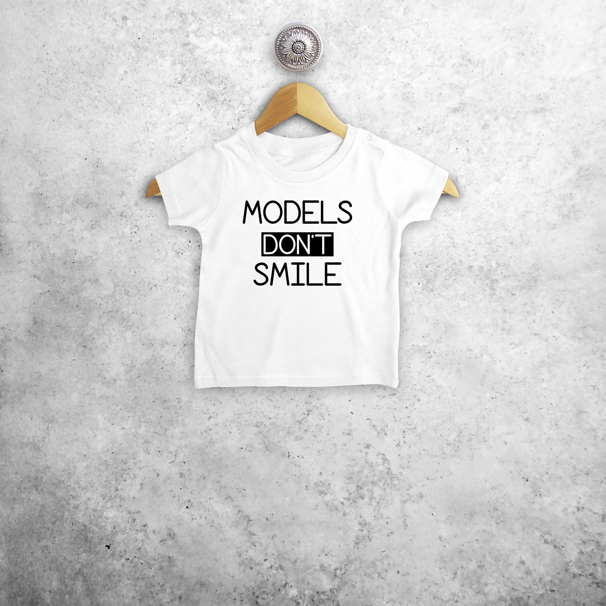 'Models don't smile' baby shortsleeve shirt