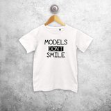 'Models don't smile' kids shortsleeve shirt