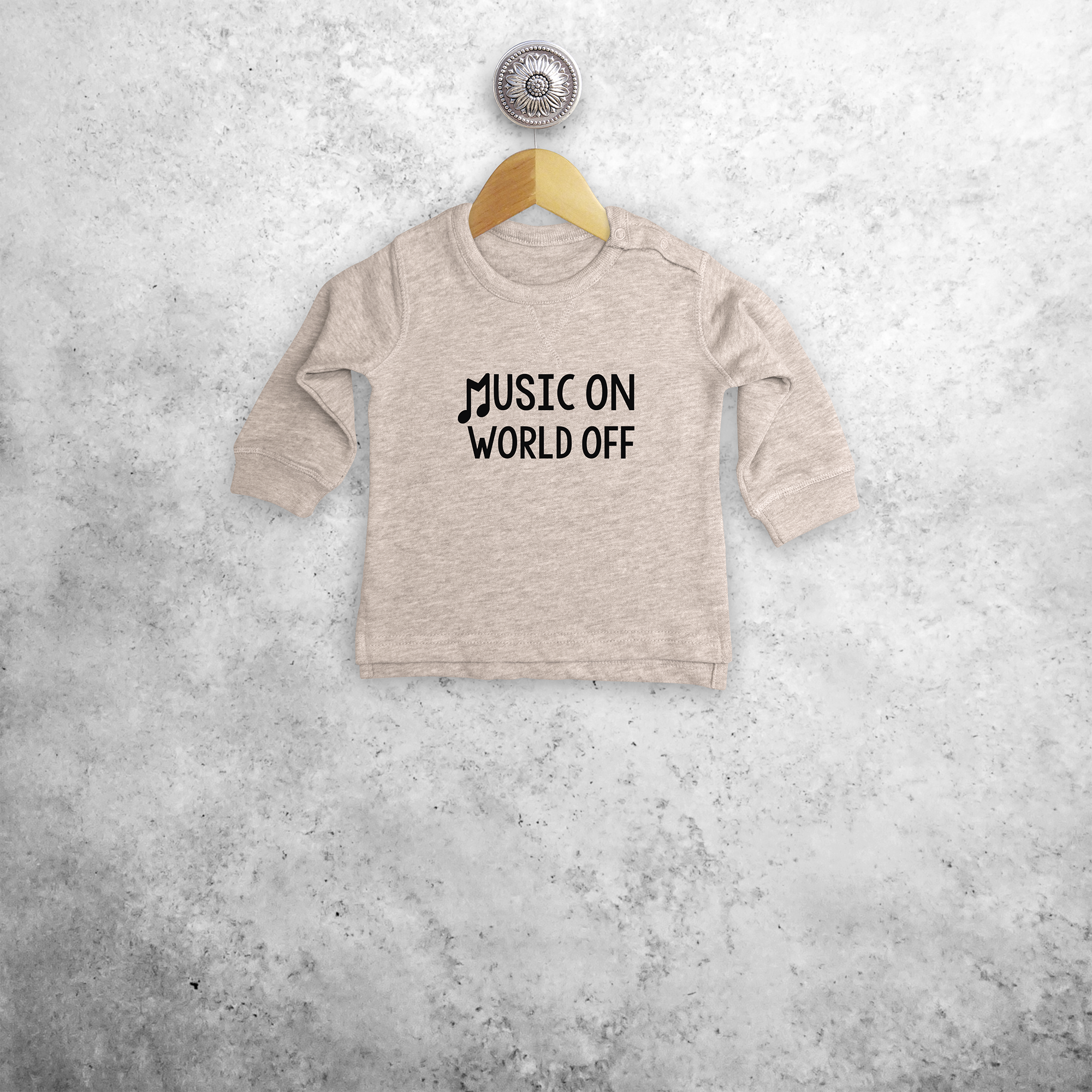 'Music on - World off' baby sweater