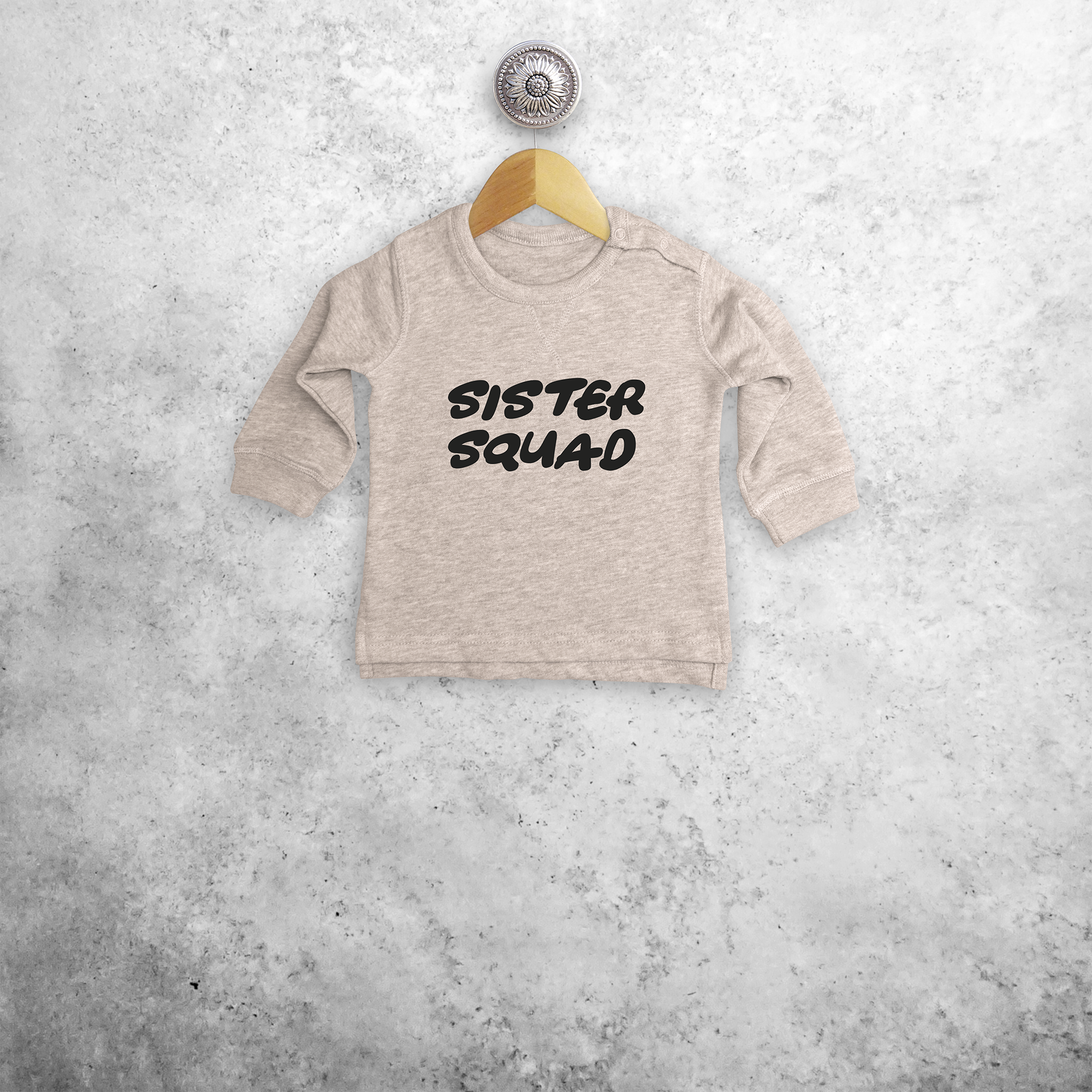 'Sister squad' baby sweater