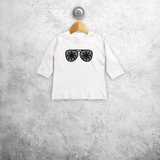 Baby or toddler shirt with long sleeves, with glitter snow star glasses print by KMLeon.