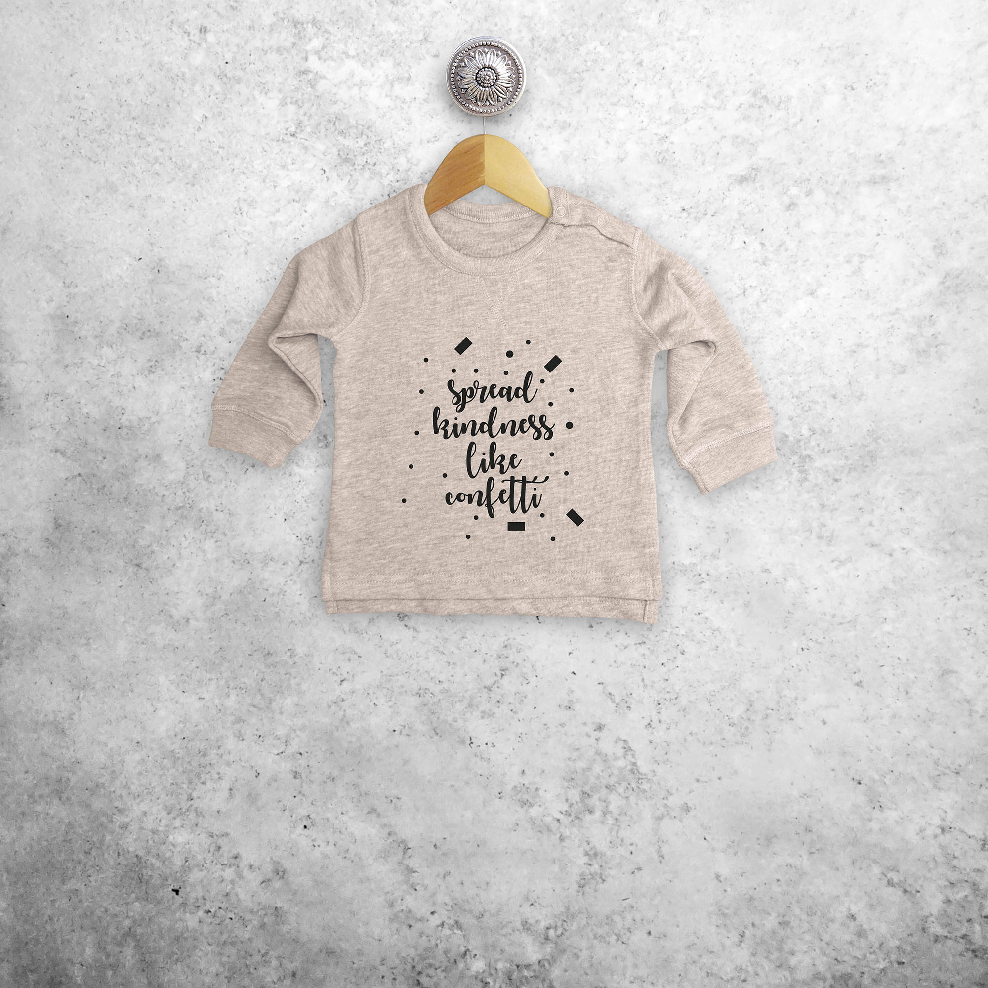 'Spread kindness like confetti' baby sweater